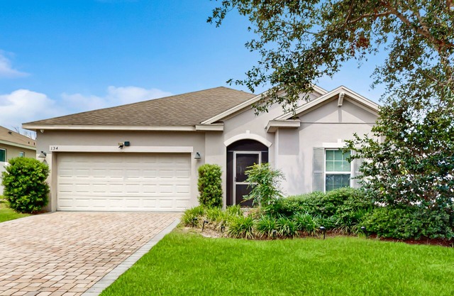Dog-friendly ground-floor home in gated community w/lake views & enclosed patio
