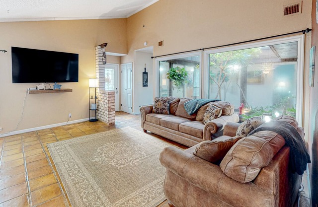 Dog-friendly home with enclosed yard, outdoor living, private atrium & Ping-Pong