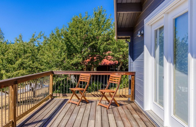 Dog-friendly home with amazing river views, shared pool, deck, grill, fireplace