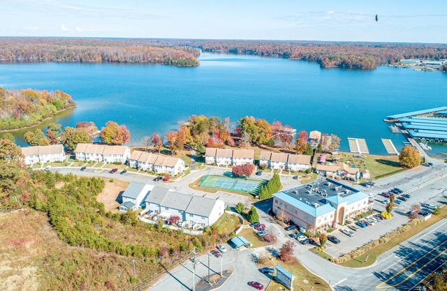 Dog-friendly lake-view townhome with firepit, grill, kayaks, tennis, AC, & W/D