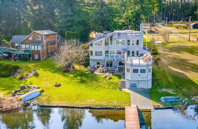 Dog-friendly, lakefront home with hot tub, dock, gorgeous deck, & game room
