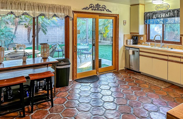 Dog-friendly retreat with enclosed yard, grill, fireplace, & AC - great location