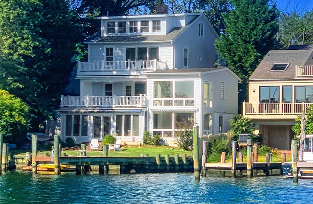 Dog-friendly riverfront home with dock, 2 balconies, waterside patio, & grill