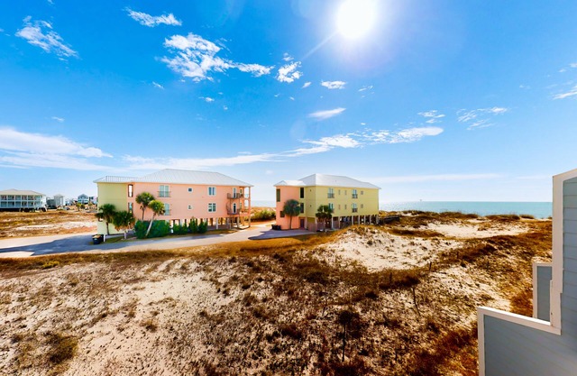 Dog-friendly townhome with Gulf views, balconies, pool, W/D, & AC - snowbirds OK