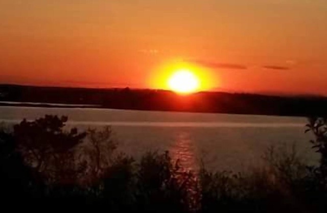 Enjoy picturesque inlet views of a working harbor and sunny days at your oceanfront cottage