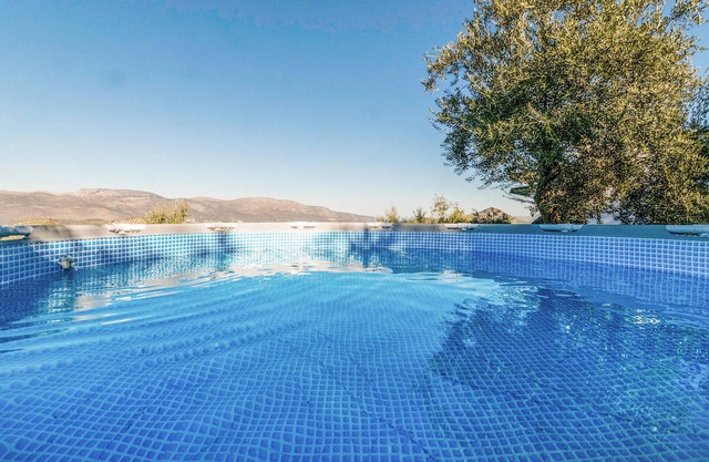 Enjoy the beautiful mountainous landscape during a vacation in this vacation home on the border of t