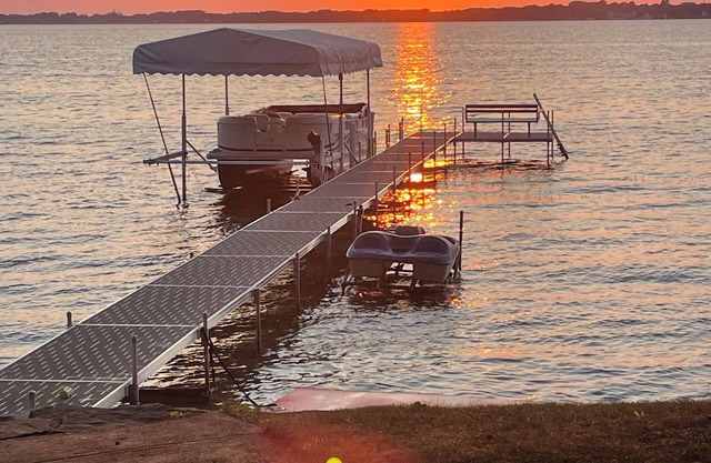 Enjoy this beach front lake home that boasts 66' of frontage with many amenities