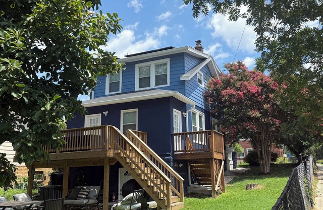 Entire two kitchen home including basement studio w/ parking, deck, and yard.