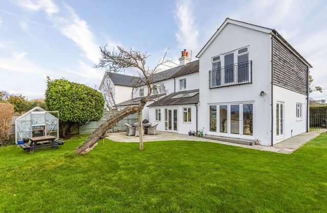 Escape to this spacious four-bedroom retreat