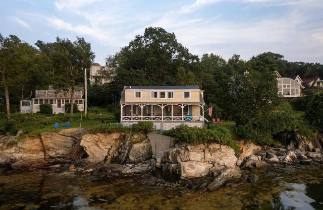 Evergreen cottage 5' from the water with private beach.