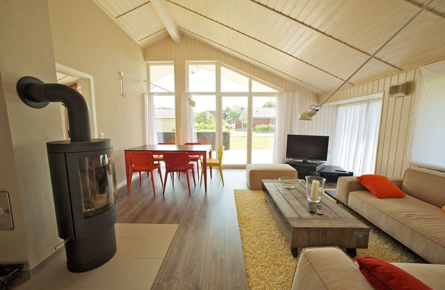 Maison en bois exclusif avec un sens élevé directement sur la digue la mer du Nord