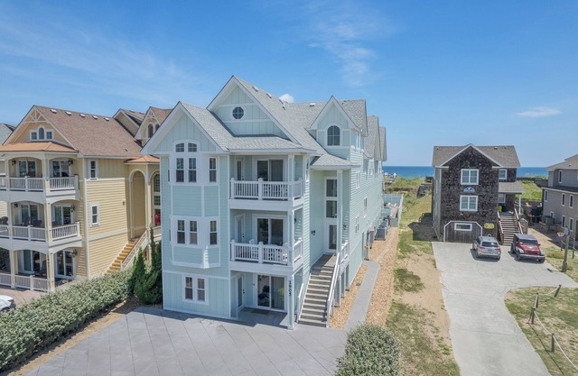 Experience luxury at Seas the Day, a stunning 15-bedroom oceanfront retreat in Kill Devil Hills