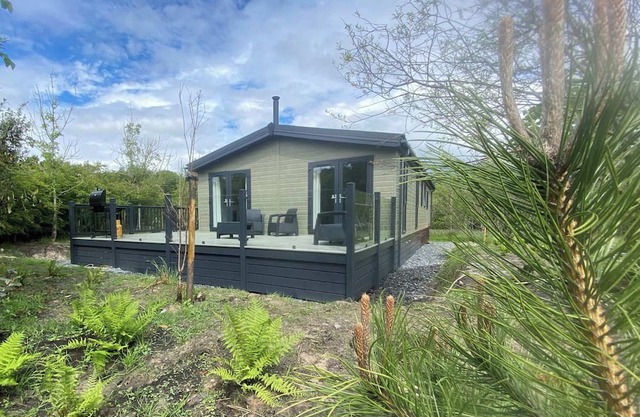 Experience the ultimate retreat in this stunning woodland lodge.