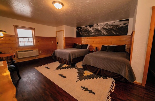 Experience Tranquility in a Premium Double Queen Room Overlooking the River and Stunning Mountain Vistas