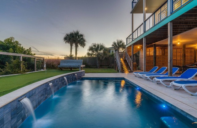 Exquisite Oceanfront Oasis: Immerse in Luxury with Pool & Putting Green at this