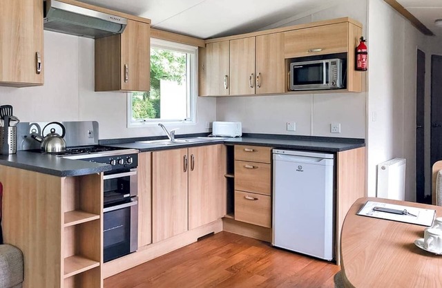 Extra spacious luxury 12ft-wide caravan with one double and one twin.
