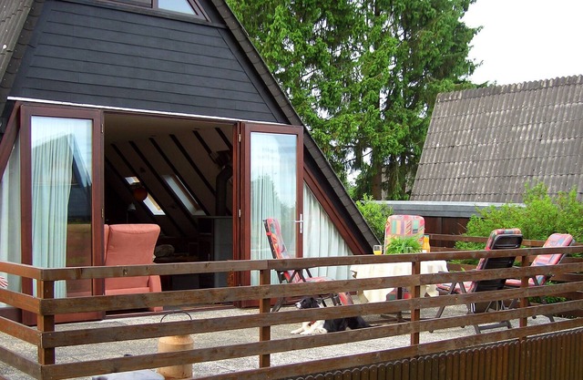 Famille chalet convivial avec cheminée et boisé
