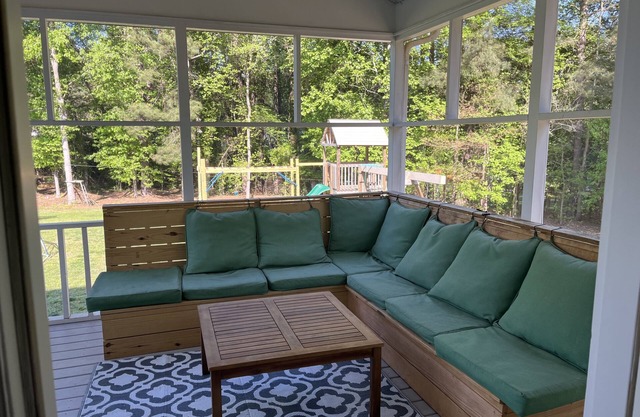 Family friendly home on over an acre with fire pit, screen porch, and more!