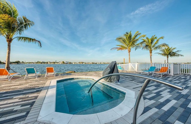 Family Friendly Waterfront Retreat! 3 Modern Suites w/ Pool & Free Parking!