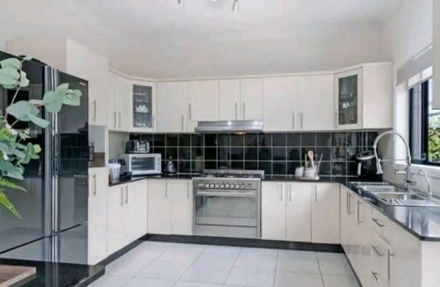 Family room with shared facilities kitchen, laundry, bathroom and living area.