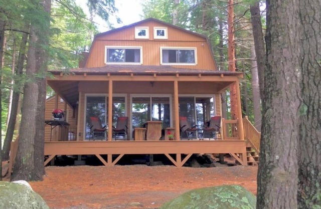 Famous cottage directly on 100' private shoreline of pristine lake.