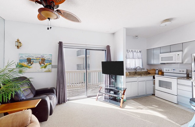 First-floor condo in a riverfront complex with a pool, steps to the beach