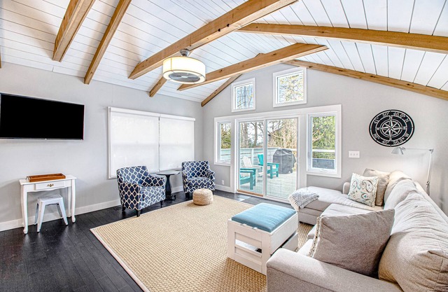 Fully-renovated lakefront home with beach cabana, association beach, & firepit