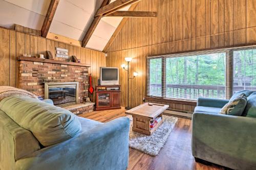 Game Room and Fire Pit Tree-Lined Pocono Lake Cabin