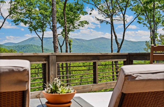 Gated mountaintop retreat with expansive outdoor living, game tables, & hot tub
