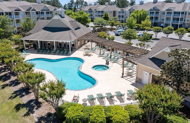 Golf community condo near beach with on-site pool, golf, & screened balcony