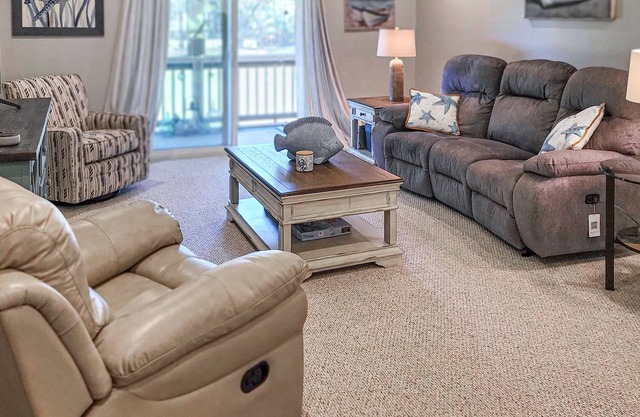 Golf escape with beach access, shared pool, balcony, patio, fast WiFi & AC