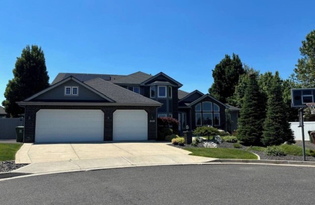 Gorgeous 6-bedroom home with theater, spa and gym, and more, on parklike grounds