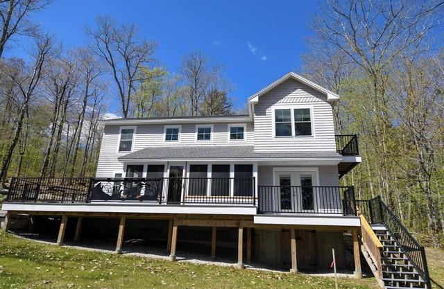 Gorgeous newly built contemporary home with large sandy beach on Long Lake!