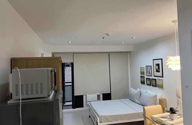 Gramercy Residences studio with Balcony facing city skyline