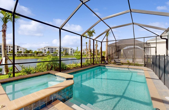 Heritage Landing home with water views, private pool, spa, grill kitchen, & W/D
