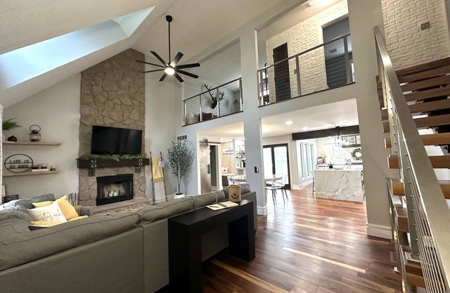 High-end home w/ fireplace, gourmet kitchen, sauna, game rm/ large yard/fire pit