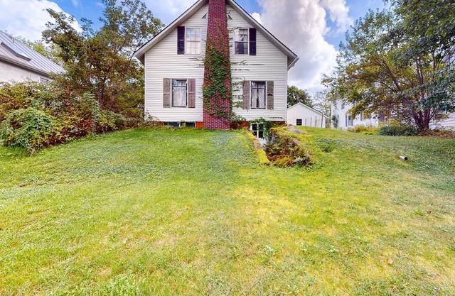 Historic, two-story 1860s home with a large yard, washer, & fireplace