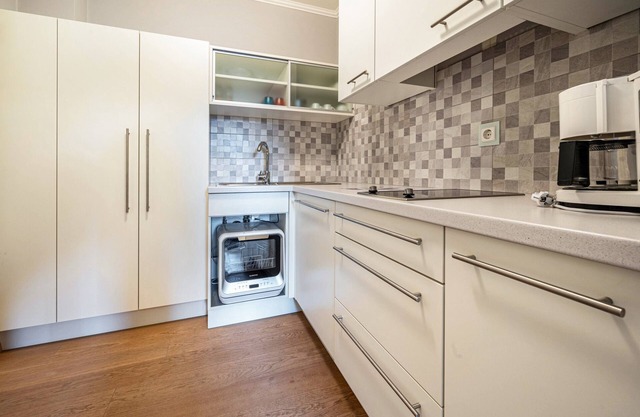 Appartement de vacances "Alpen Living" avec vue sur les montagnes, jardin partagé et Wi-Fi.