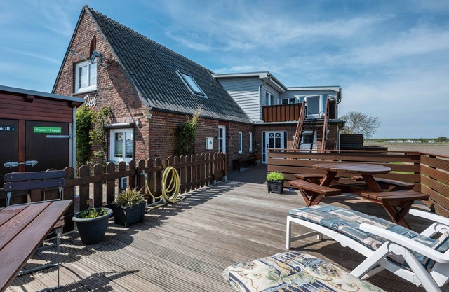 Appartement 'Huus Achtern Diek' avec terrasse partagée et Wi-Fi