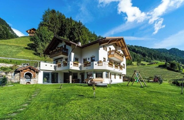 Appartement "Rauchkofel", avec bain à remous et jardin partagés.