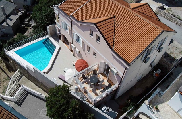 Holiday apartment with garden and pool