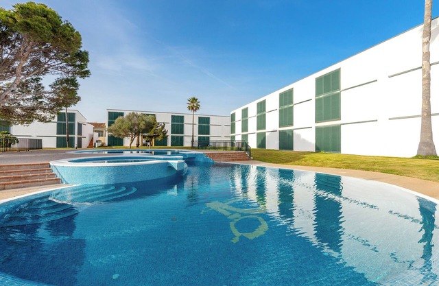 Maison de vacances 'Cala'n Bosch 1a Planta' avec piscine partagée, jardin partagé et climatisation