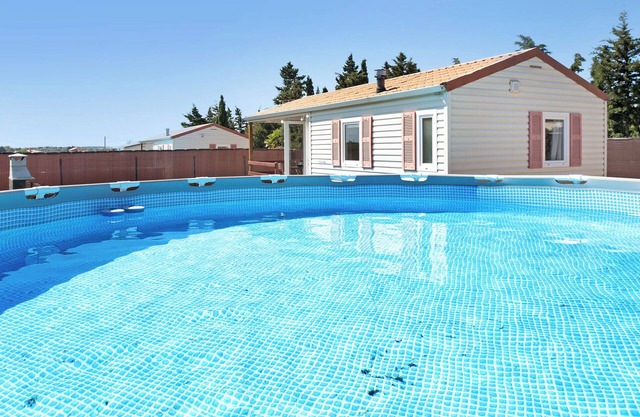 Maison 'Eloy Playa 3 - Sólo Familias' avec piscine, jardin & Wi-Fi
