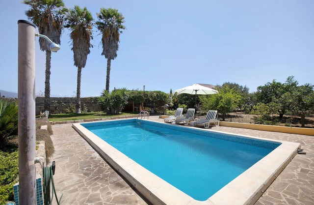 Maison de vacances "Las Tres Palmeras" avec vue sur les montagnes, piscine partagée et Wi-Fi