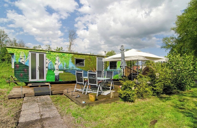 Maison de vacances 'Süßes Häuschen Am See' avec terrasse privée et jardin privé