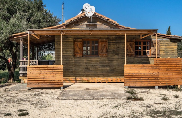 Maison de vacances "Maison en bois" avec vue sur les montagnes et jardin.