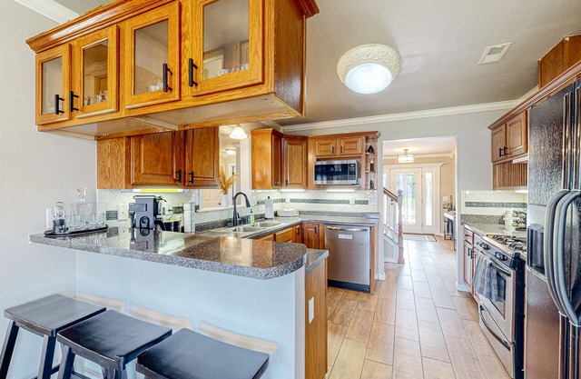 Home in great location with fenced yard, fireplace, bikes, grill, patio, dogs OK