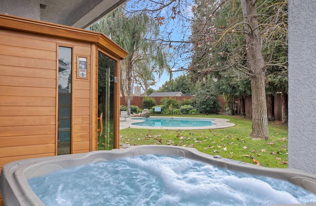 Home oasis with sauna, jacuzzi, pool & heated gazebo!