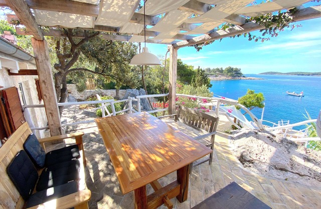 house for two with a private terrace located directly on the beach, town Hvar