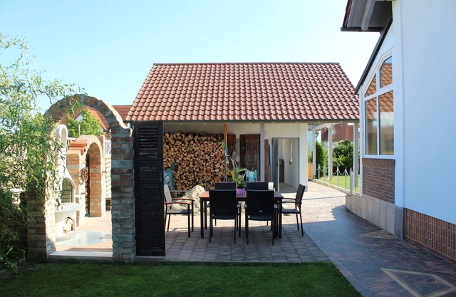Maison avec jardin d'hiver et terrasse